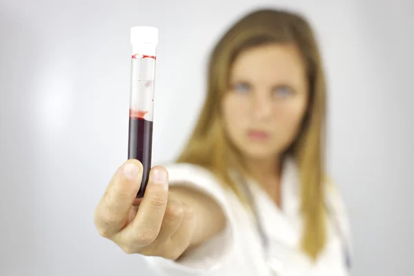 Female doctor with blood sample in hand