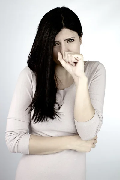 Woman feeling sick coughing and holding mouth and stomach