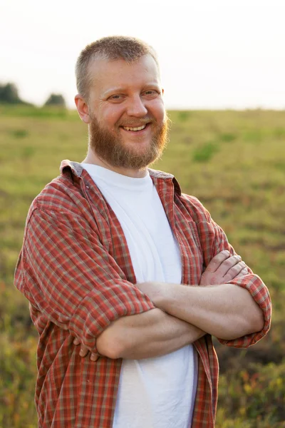 Happy red-bearded man in a shirt