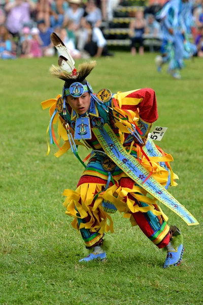 Teenage boy performs traditional native dance