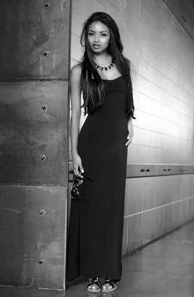 Beautiful young woman wearing black dress