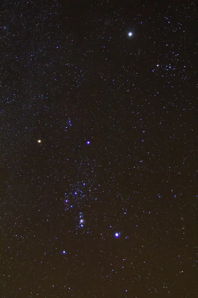 Closeup orion constellation on a starry sky background