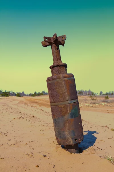 Old rusty bom in a sand desert