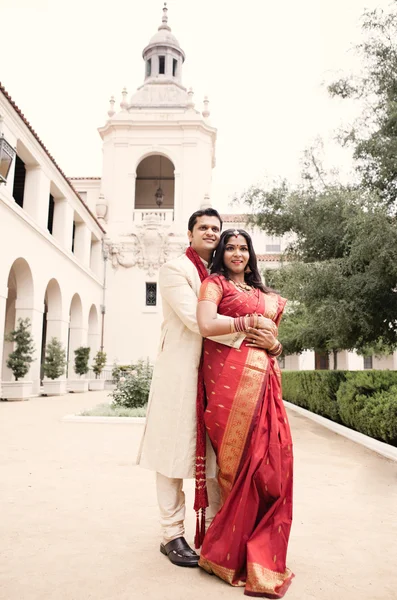 Beautiful Indian bride and groom embracing