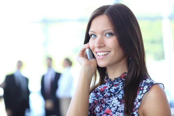 Beautiful business woman talking on cell phone