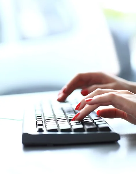 Worker typing on keyboard