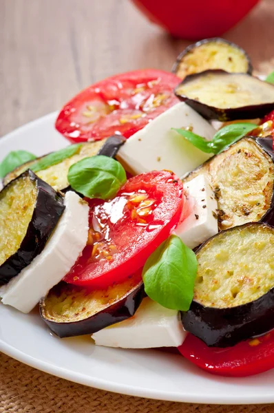 Eggplant salad with tomato and feta cheese