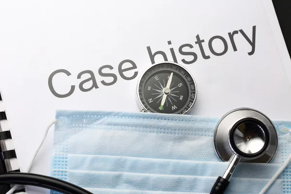 Case history, stethoscope, compass and mask