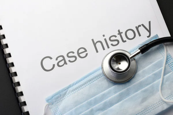 Case history, stethoscope and mask