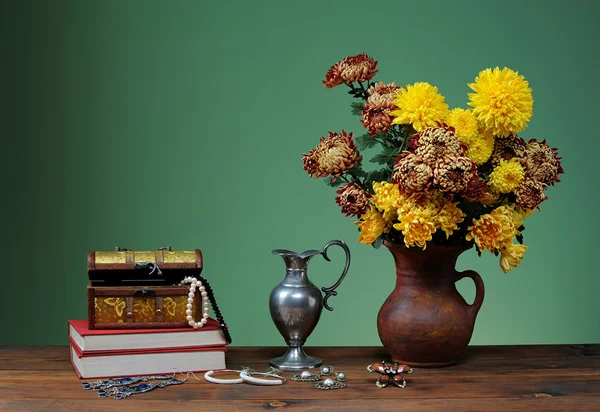 Jewelry in the box and the flowers