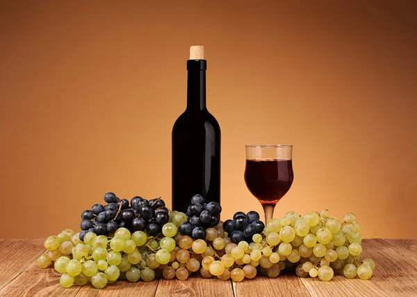 Fresh grapes, bottle and glass of wine