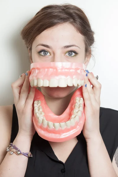 Woman false teeth