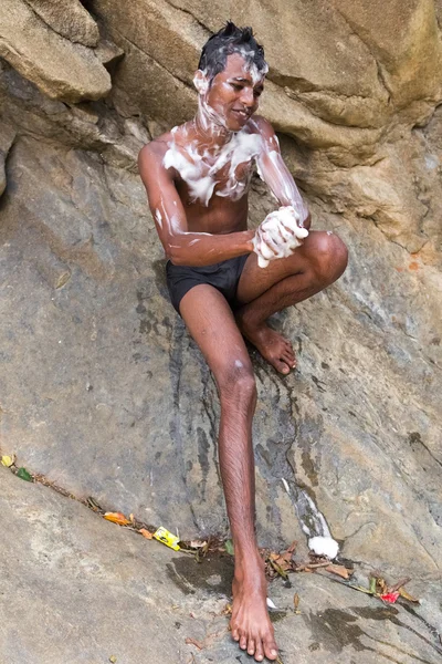 Local boy covered with soap at Ravana falls