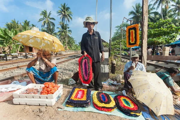 Local street vendors selling mats
