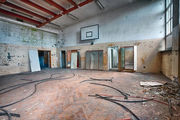 Abandoned sports hall in a devastated building