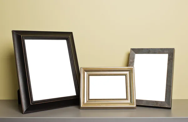 Photo frames on old table