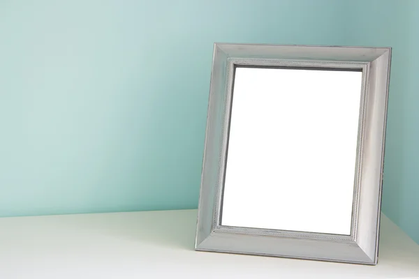 Blank picture frame at the desk