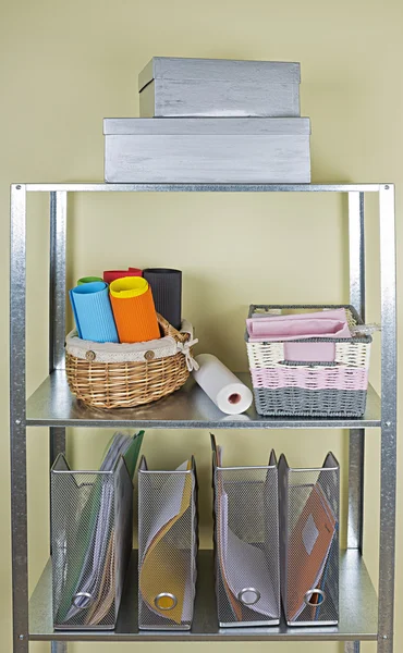 Metal shelves with different home related objects