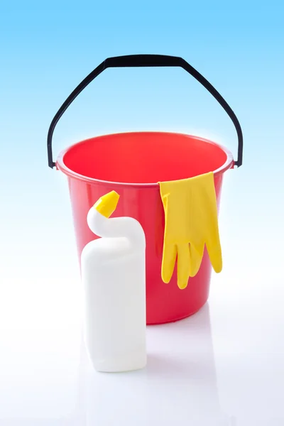 Cleaning detergents and red bucket