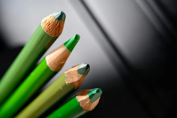 Unsharpened green pencils