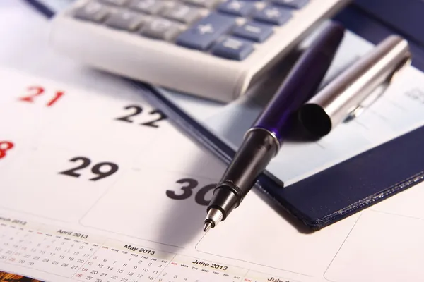 Pen, Calculator, Calendar and Cheque Book