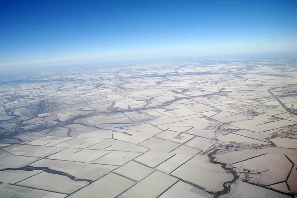 View of Earth from a height covered with snow during the winter season