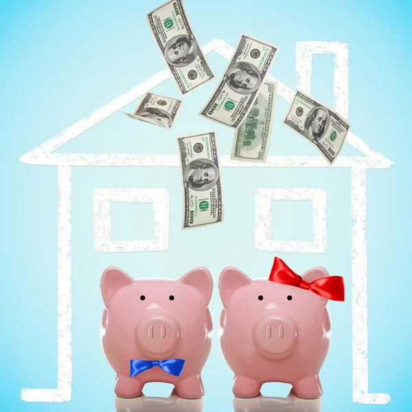 Piggy bank couple buying their dream home