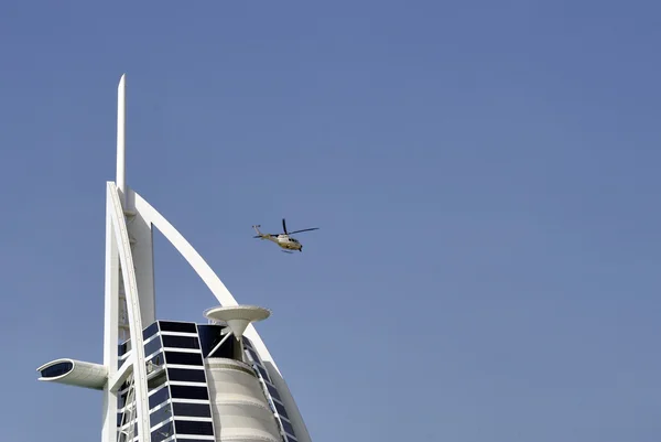 Burj Al Arab hotel with leaving helicopter