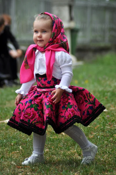 In traditional dresses at a wedding