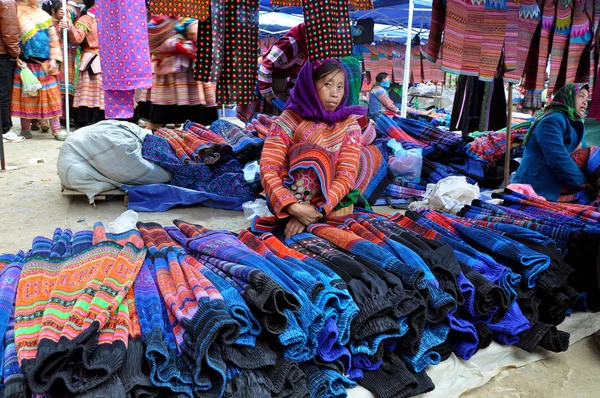 Woman from Black H\'mong minority tribe selling textile in Bac Ha market, Vietnam