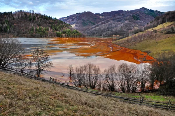 Contaminated lake full with mining waste residuals in Rosia Mont