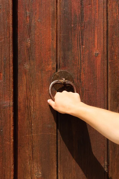 Knocking on a wooden door