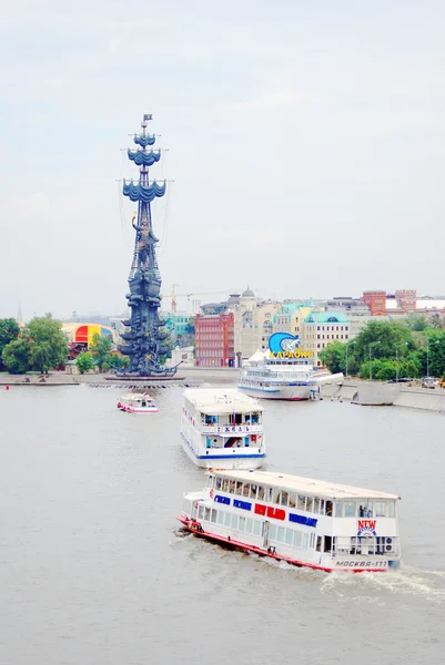 A cruise ship sails on the Moscow river. Moscow city center panorama in summer.