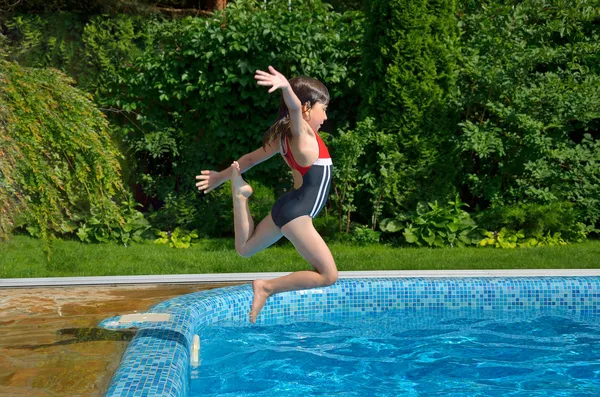 Girl jumps to swimming pool