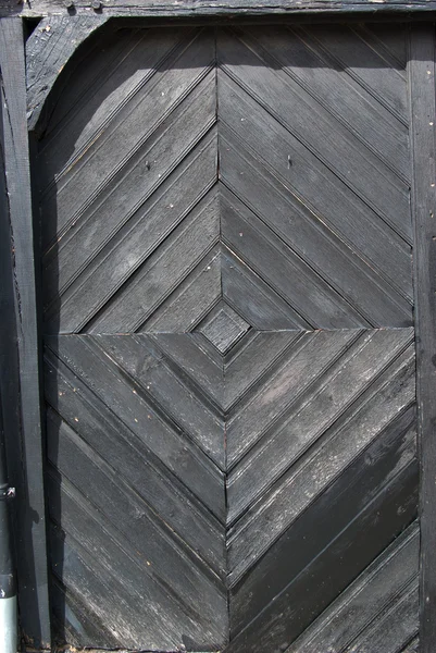 Bright traditional black painted wooden door