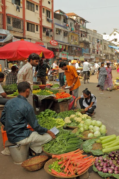 Street vendors sell vegetables