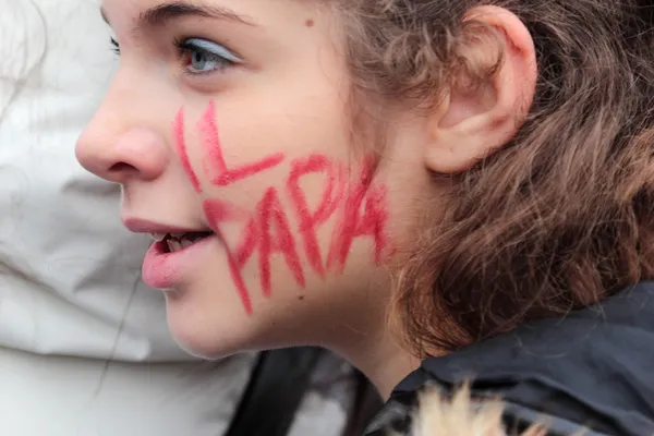 Young italian faithful with \'The Pope\' written on the cheek