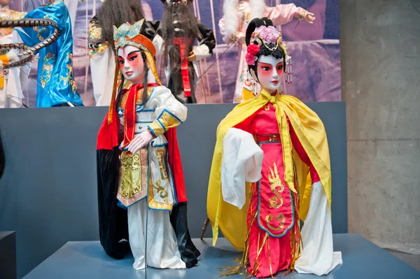 Human sculptures in the puppet theater, Made in China