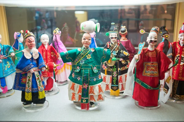 Human sculptures in the puppet theater, Made in China