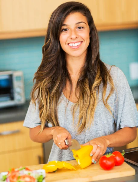 Woman chopping vegitables, preparing healthy dinner