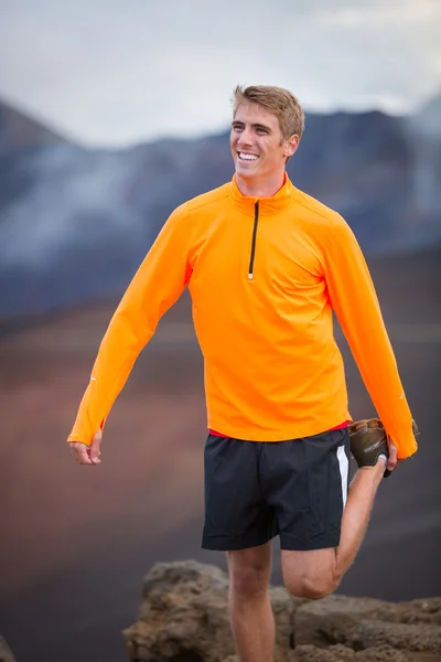 Young attractive athletic man, wearing sporty cloths on trail, s