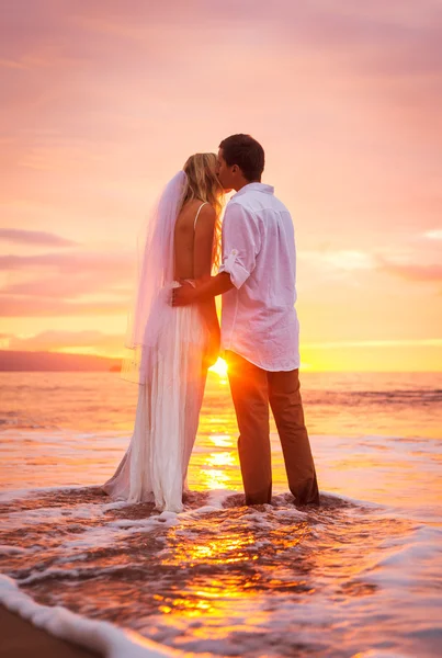 Bride and Groom, Enjoying Amazing Sunset on a Beautiful Tropical