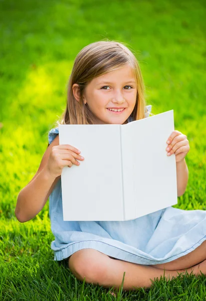 Adorable cute little girl reading book