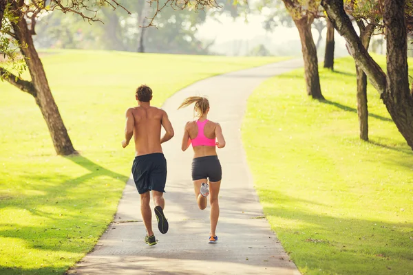 Couple running in park
