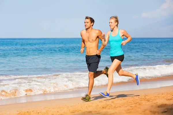 Couple running on the beach