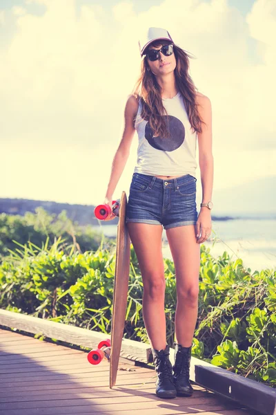 Hipster girl with skate board