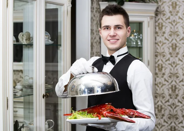 Waiter with a tray of food