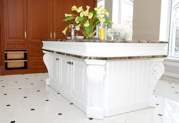 Stylish kitchen with marble table