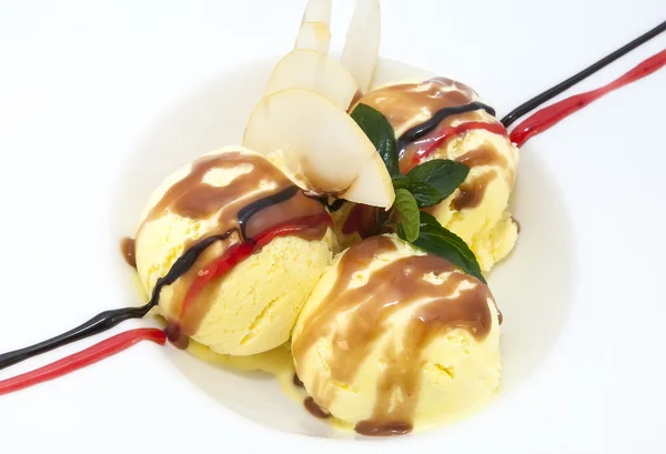 Ice cream with caramel sauce and mint