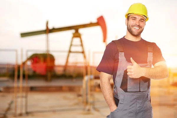 Refinery worker reads the data from the black plates